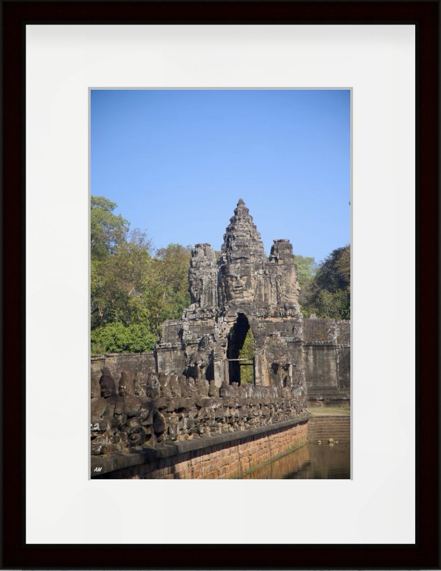 South Gate of Angkor Thom with stone faces and statues of gods and demons - Cambodia photography